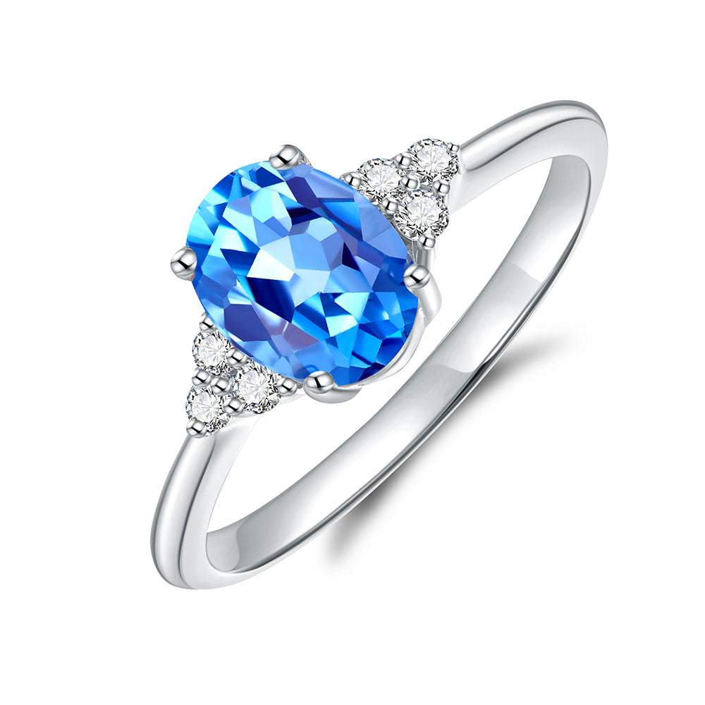 9k White Gold Blue Topaz and Diamond Ring