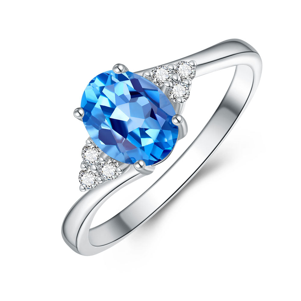 9k White Gold Blue Topaz and Diamond Ring